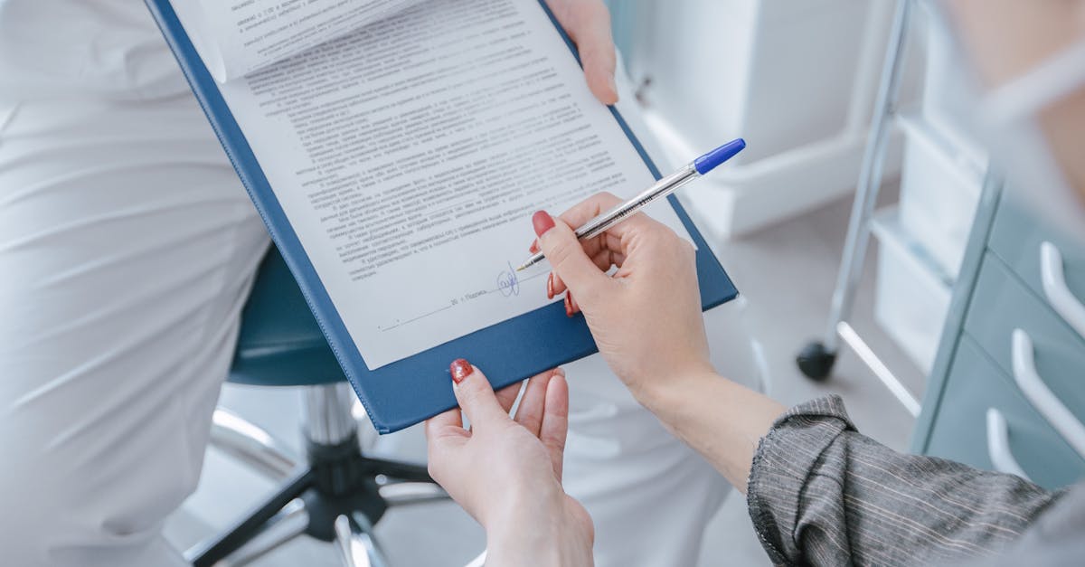 Doctor overwhelmed by stacks of medical paperwork and invoices in a clinic office.