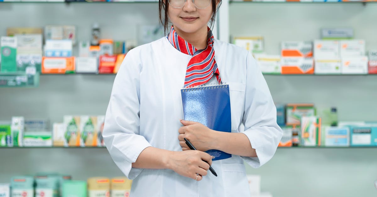 Clinic staff member uses a barcode scanner to update medical supply inventory on a digital system, demonstrating stock control.