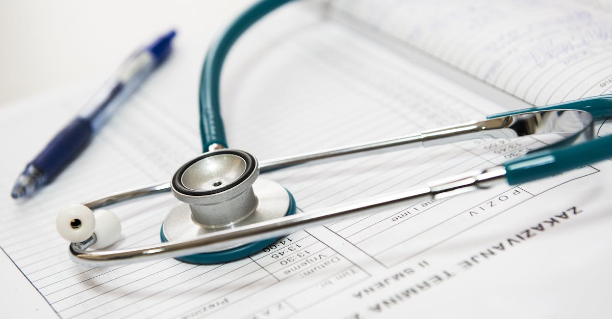 Doctor shows a patient their electronic health record on a tablet during a consultation.