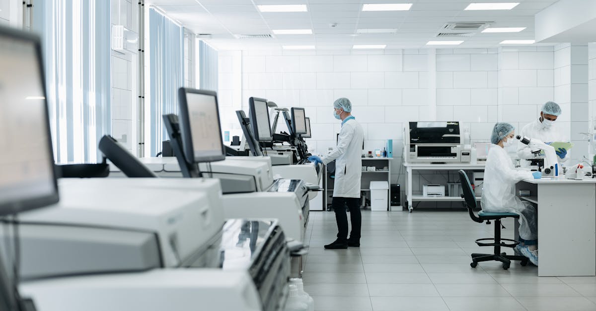 Clinic manager analyzing healthcare data analytics and performance reports on a computer screen.