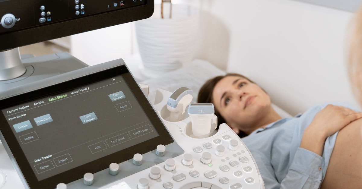 Close-up of a clinic management system dashboard on a computer screen showing patient analytics and scheduling.